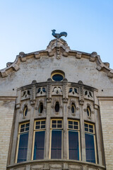 Building with cockerel  sculpture on the roof on Anspatch Boulevard, Brussels, Belgium