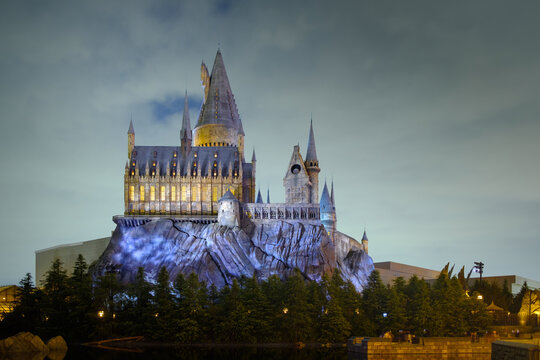 OSAKA, JAPAN - 02022023: Universal Studios Japan . The Hogwarts castle reflect to the water in The Wizarding World of Harry Potter in Universal Studio Osaka