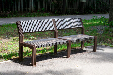 Fototapeta premium Wooden bench in the city park
