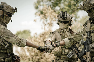 United States Army ranger during the military operation. Professional marine soldiers training with weapon on a military range.