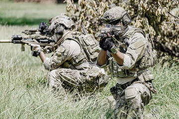 United States Army ranger during the military operation. Professional marine soldiers training with weapon on a military range. © FotoArtist