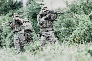 United States Army ranger during the military operation. Professional marine soldiers training with...
