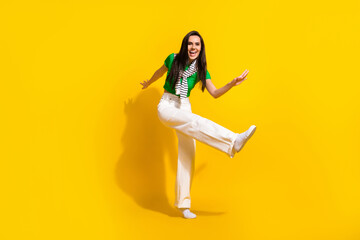 Full length photo of nice overjoyed person enjoy dancing partying good mood isolated on yellow color background