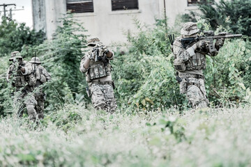 United States Army ranger during the military operation. Professional marine soldiers training with...