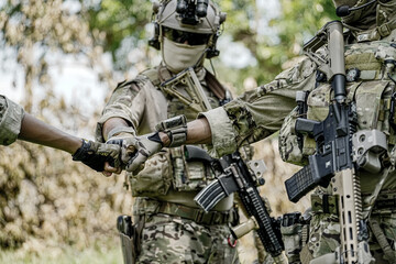 United States Army ranger during the military operation. Professional marine soldiers training with...