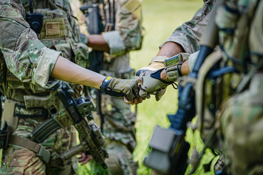 United States Army ranger during the military operation. Professional marine soldiers training with weapon on a military range.