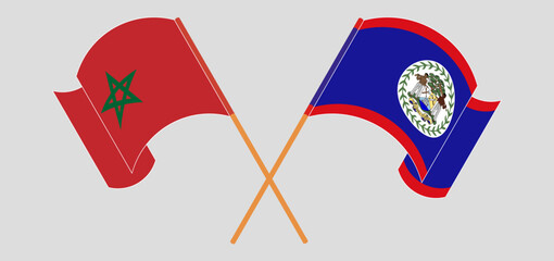 Crossed and waving flags of Morocco and Belize