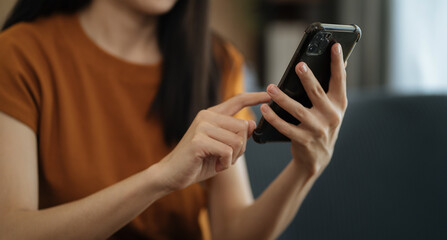 Women are using smartphonet to Social media at morning light.