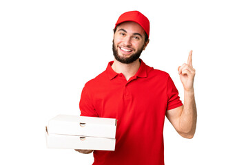 pizza delivery man with work uniform picking up pizza boxes over isolated chroma key background...