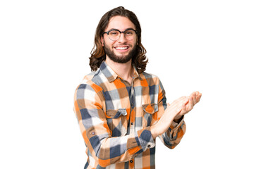 Young handsome man over isolated chroma key background applauding