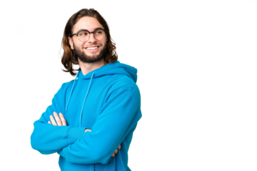 Young handsome man over isolated chroma key background with arms crossed and happy