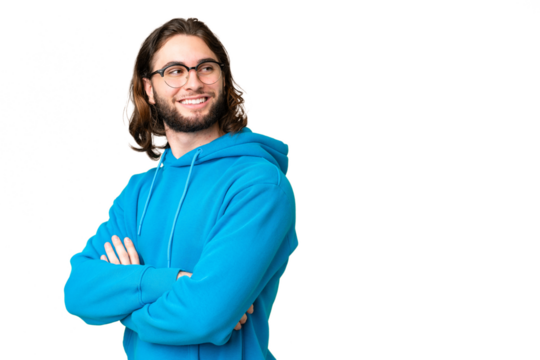 Young handsome man over isolated chroma key background with arms crossed and happy