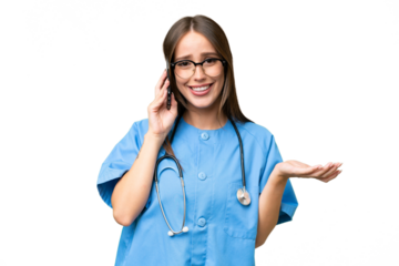 Young nurse caucasian woman over isolated background keeping a conversation with the mobile phone with someone