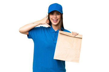 Young beautiful caucasian woman taking a bag of takeaway food over isolated background making phone gesture. Call me back sign