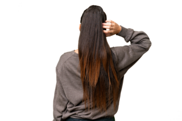 Young Arabian woman over isolated chroma key background in back position and thinking