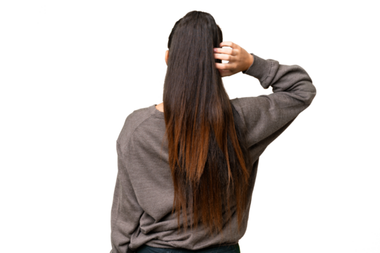 Young Arabian woman over isolated chroma key background in back position and thinking