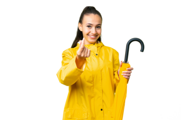 Young Arabian woman with rainproof coat and umbrella over isolated chroma key background making money gesture