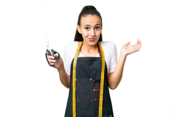 Young Seamstress woman over isolated chroma key background having doubts while raising hands