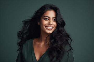 Fototapeta premium A young cute smiling female of Indian ethnicity with a long flowing hair