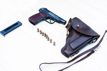 Retro pistol with cartridges and a holster on a white background. Close up. selective focus