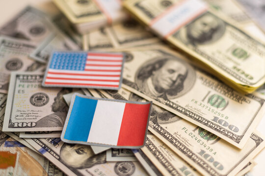 us and france flags with euro and dollar banknotes mixed image