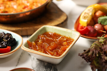 Traditional Turkish Breakfast served with traditional turkish tea on marble table