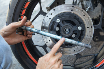 Fototapeta premium Changing the lubrication and cleaning the bearings of the motorcycle. Maintenance, repair motorcycle