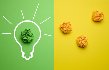 The concept of inspiration with new ideas, the search for creative solutions, crumpled sheets of...