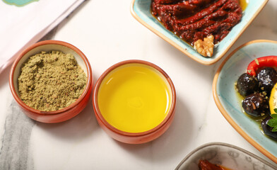 Traditional Turkish Breakfast served with traditional turkish tea on marble table, healty olive oil for breakfast