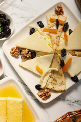 Traditional Turkish Breakfast served with traditional turkish tea on marble table, cheese platter for a traditional Turkish breakfast