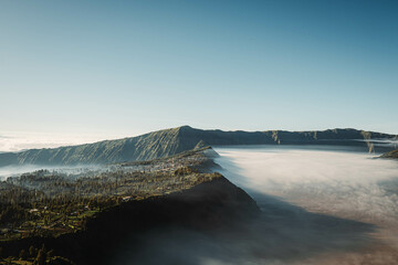 Cemoro Lawang village is covered by clouds near Mount Bromo viewed from Seruni Sunrise Point