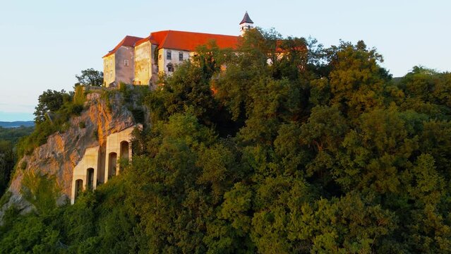 Captivating 4K drone footage of Castle (Grad) Borl, a historic gem with a haunting past as Gestapo Prison in World War Two. Filmed in the stunning sunset time with the view of the surroundings.