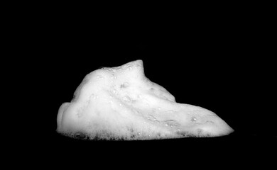 liquid white foam from soap or shampoo or shower gel Abstract soap bubbles. Set foam, soap bubble isolated on black, with clipping path texture and background.	
