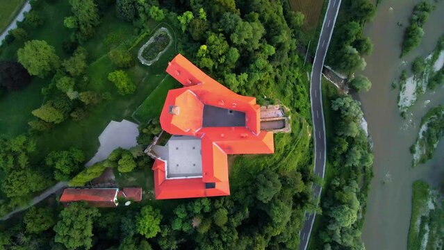 Captivating 4K drone footage of Castle (Grad) Borl, a historic gem with a haunting past as Gestapo Prison in World War Two. Filmed in the stunning sunset time with the view of the surroundings.