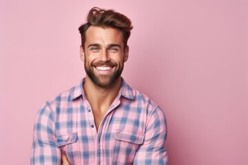 Portrait of handsome young man in checkered shirt on pink background - Powered by Adobe