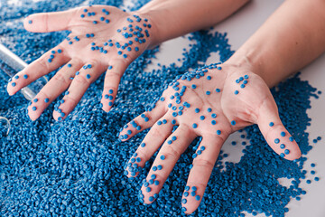 White plastic grain, plastic polymer granules,hand hold Polymer pellets, Raw materials for making...