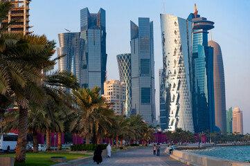  Modern glass fronted skyscrapers and office towers line the Corniche seaside in Doha, Qatar - obrazy, fototapety, plakaty