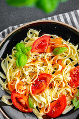 pasta fresh tomato tagliatelle meal food snack on the table copy space food background rustic top view