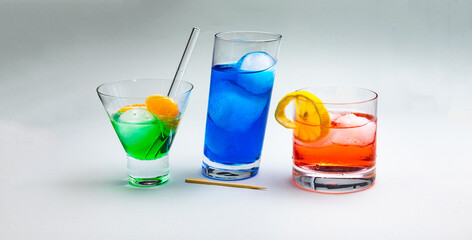 Colorful cocktail with ice cubes isolated in the studio