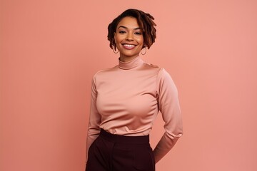 Cheerful african american woman posing on pink background. - Powered by Adobe