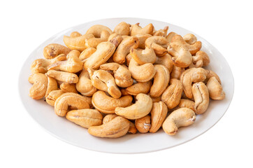 Roasted brown cashew nuts in stack on white plate isolated on white background with clipping path...