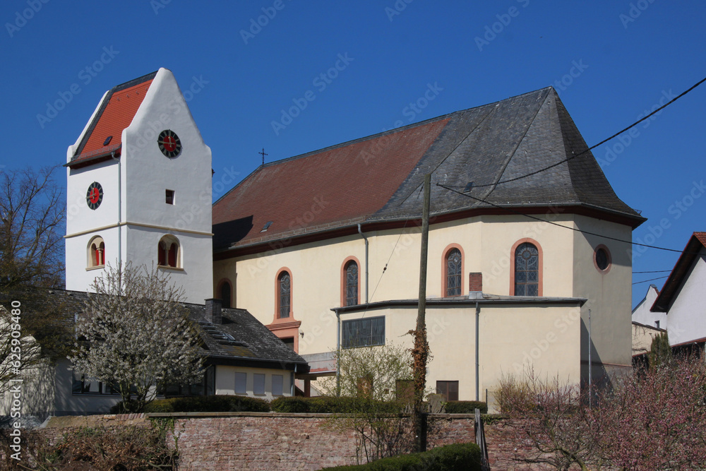 Wall mural baroque church with romanesque bell tower in the old village of frei-laubersheim in germany