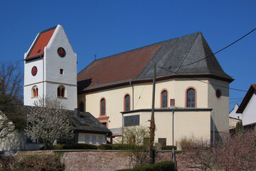 Baroque church with romanesque bell tower in the old village of Frei-Laubersheim in Germany