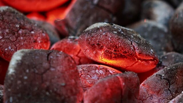 Glowing Charcoal Briquettes, BBQ oder close up of coals burning
