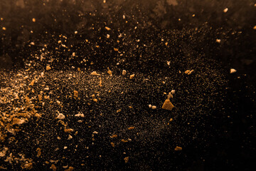Abstract image made with flour and breadcrumbs on dark background. Conceptual image, alluding to...