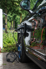Electric SUV charging at a Dutch public charging station

