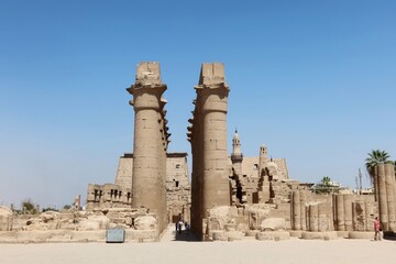 The great stone columns and statues in Luxor temple in the East bank in  Egypt