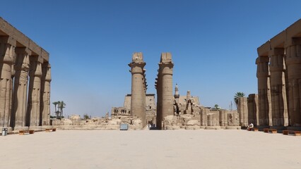 Fototapeta premium The great stone columns and statues in Luxor temple in the East bank in Egypt