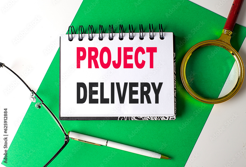 Poster project delivery text on notebook on green paper
