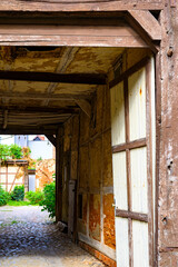 View of a gateway to a backyard in a historic building in Salzwedel, Germany.